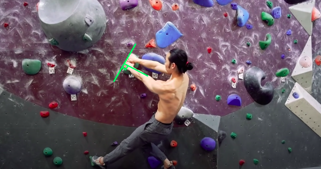 Man rock climbing indoors and following the 90 degree rule
