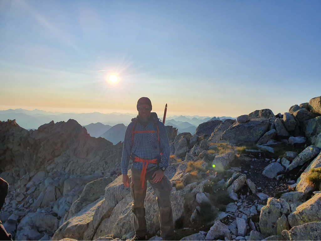 ice climbing: man on top of the Alps