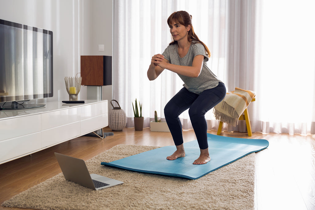 Woman does home workout