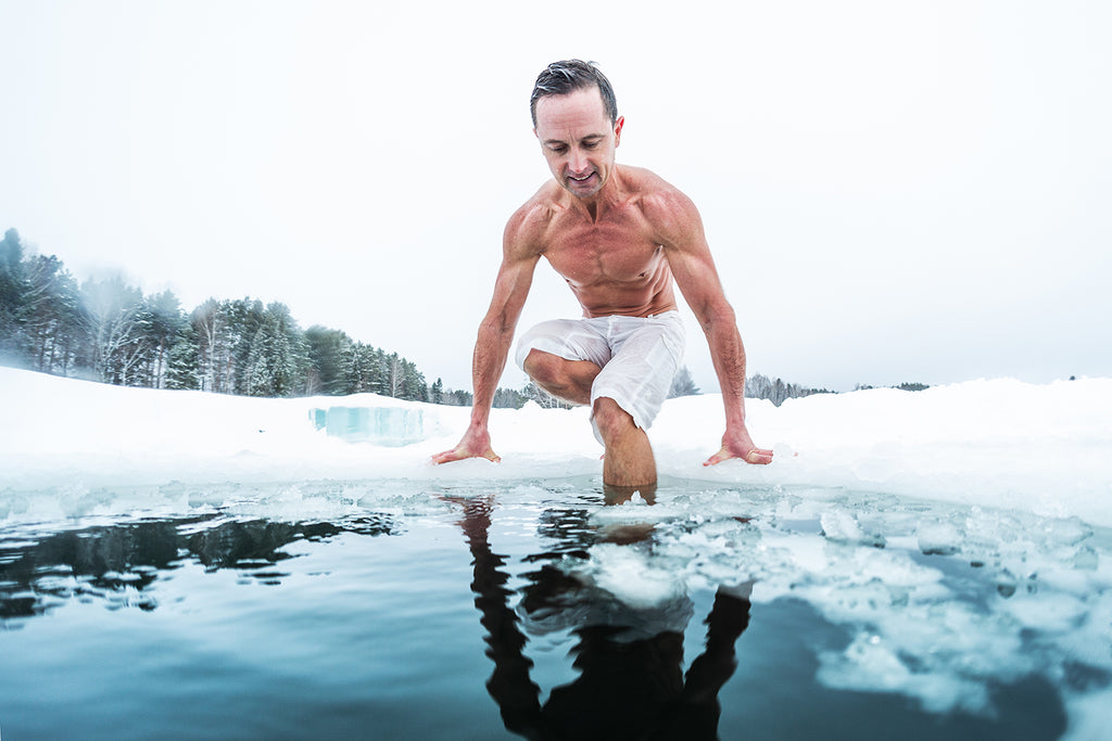 Man takes cold shower after workout