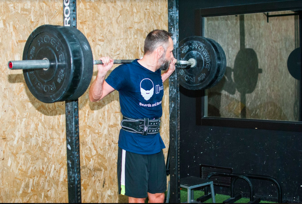 What is resistance training: Man doing weights