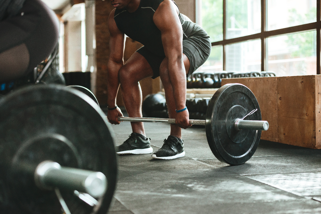Men grabbing weights