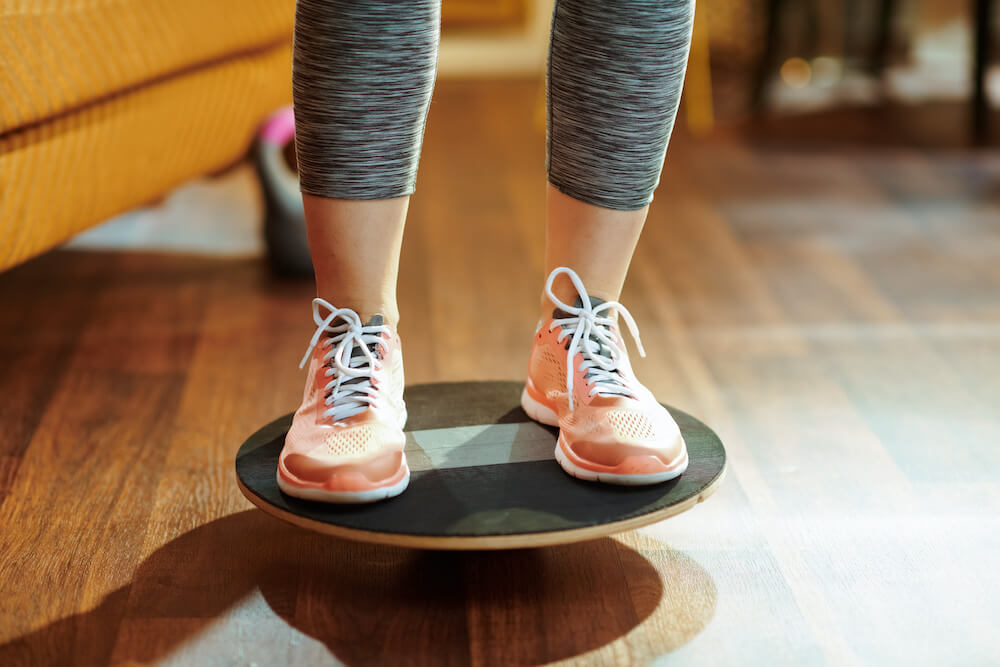 person standing on a balance board