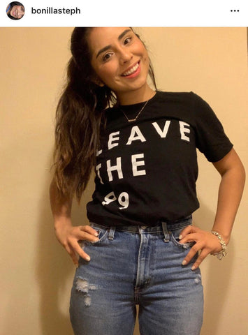 Leave The 99 black unisex tshirt worn by latina model