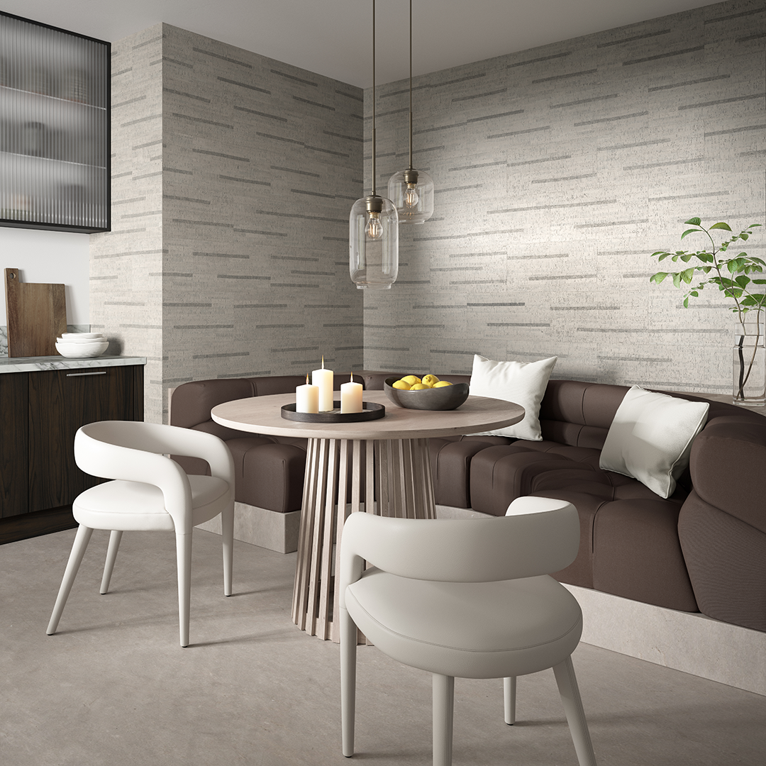 CorkWall Aveiro Silver tiles on the wall of a minimalist dining area, featuring curved seating, a round table and two chairs.