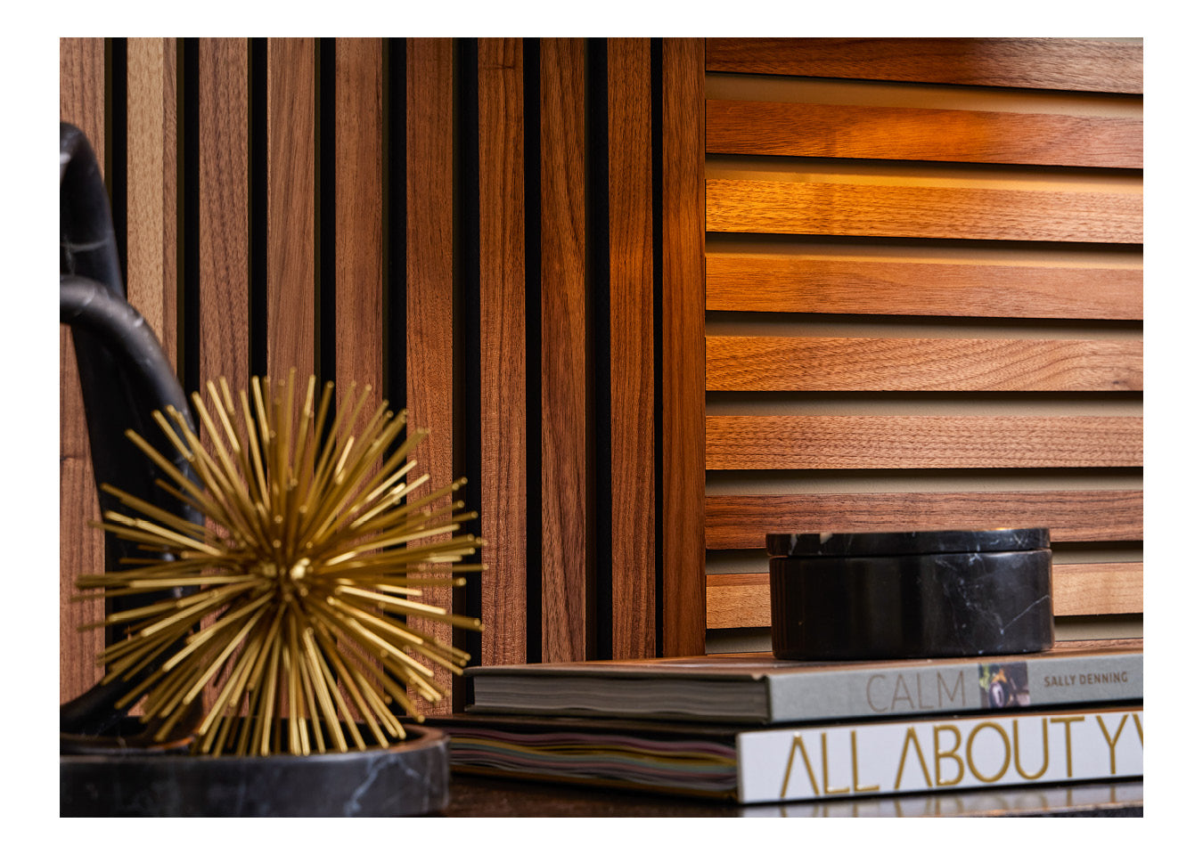 Close up image of the Deep Walnut SlatWall with books and decorative items in front on a table