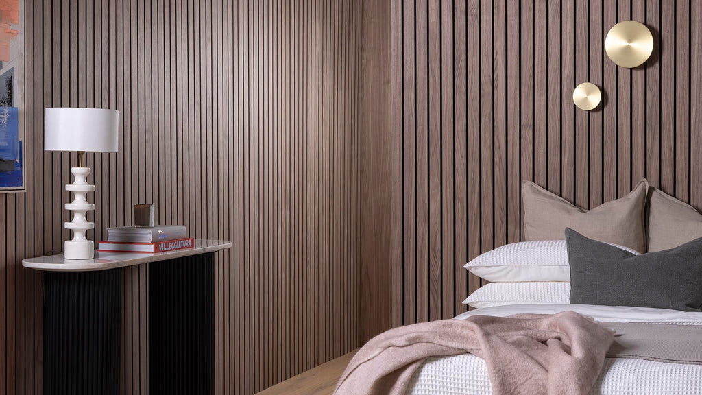 Contemporary-style bedroom featuring monochrome furniture, grey and pink accessories and SlatWall Grand Walnut panels.
