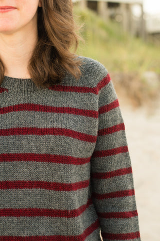 red and gray striped sweater