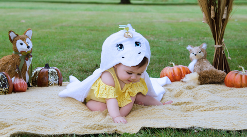 baby girl wearing kloud bambu white unicorn bamboo hooded towel for fall season