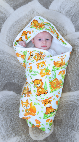 a baby lying on a mat carpet