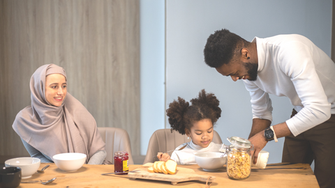 A family of three in the dining area