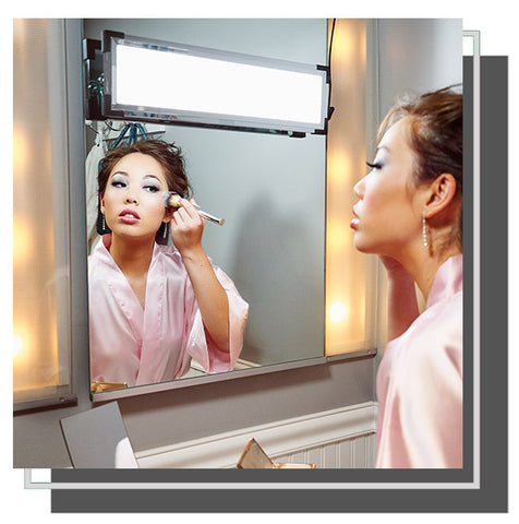 Woman applying blush in front of mirror with Eyelight