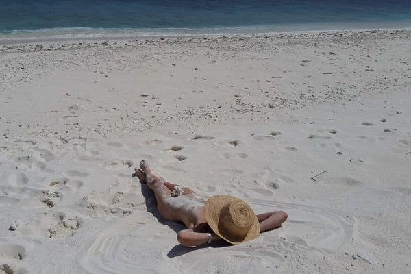 Naked lady on nudist beach