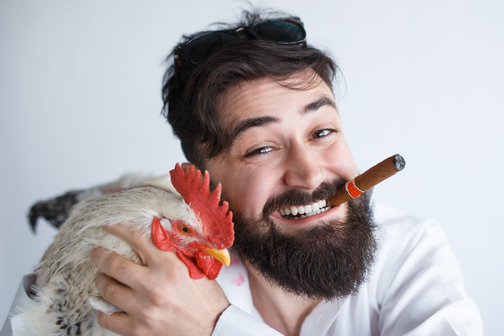 Crazy & Excitable Party Animal Man Holding Chicken With Cigar In Mouth