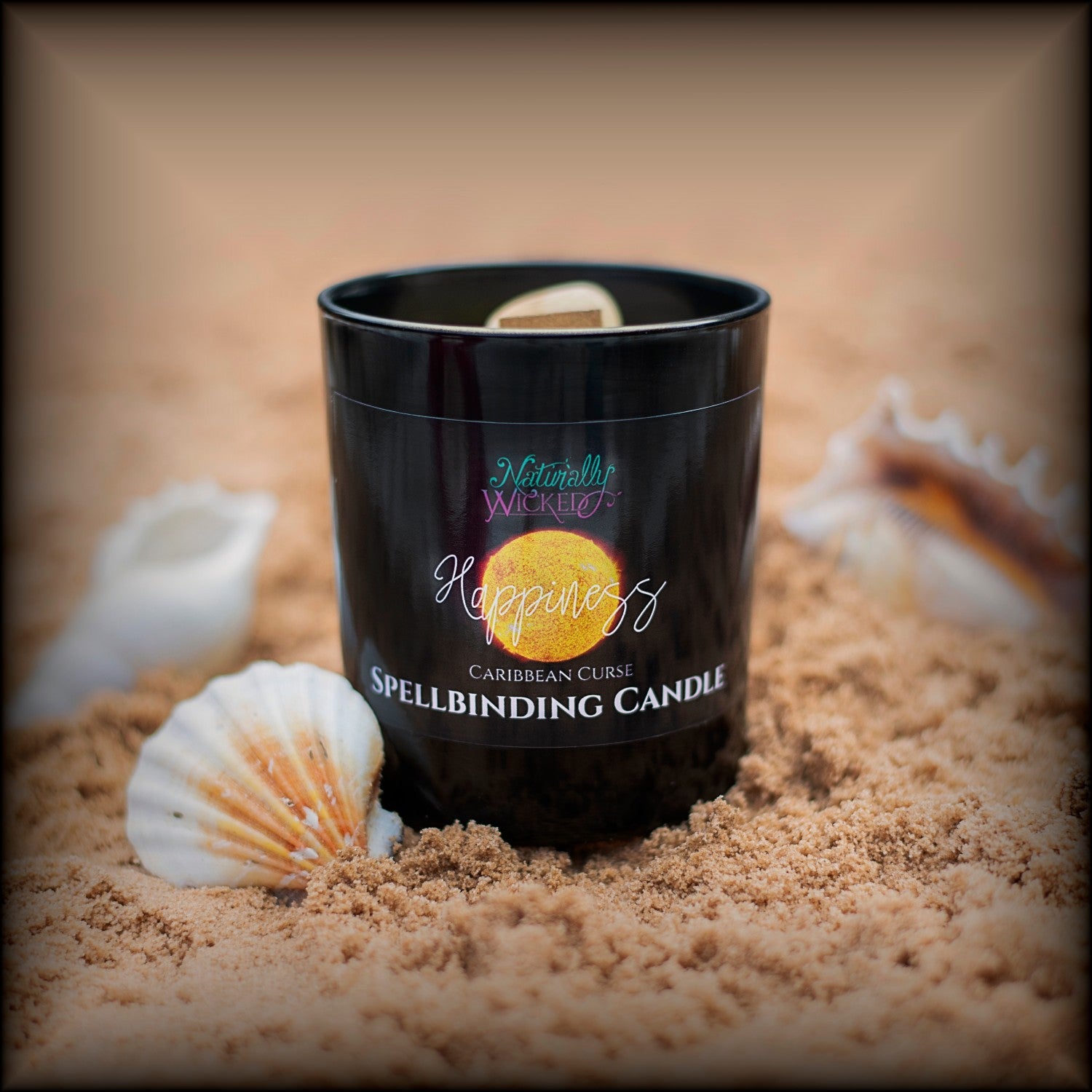 Naturally Wicked Spellbinding Happiness Spell Candle Entombed With Bright Yellow Citrine Crystal Sits On Bright Beach Surrounded By Shells