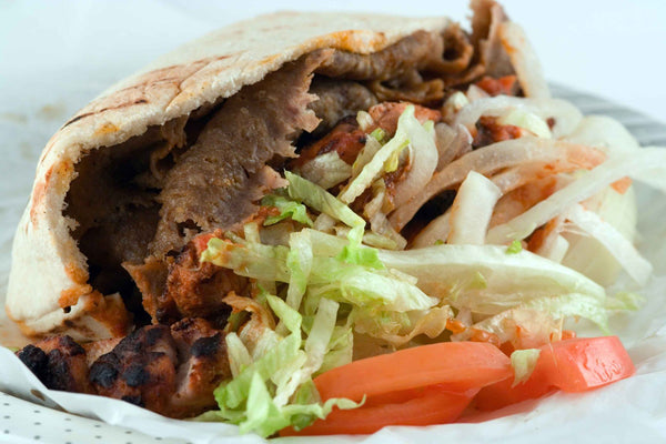 Kebab , meat, onions, lettuce and tomatoes
