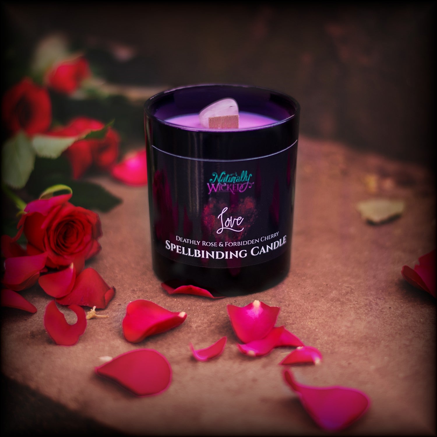 Naturally Wicked Spellbinding Love Spell Candle Entombed With Bright Pink Rose Quartz Love Crystal Sits On Romantic Steps Drizzled In Red Rose Petals