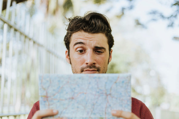 Man With Map Looking Confused - Naturally Wicked 