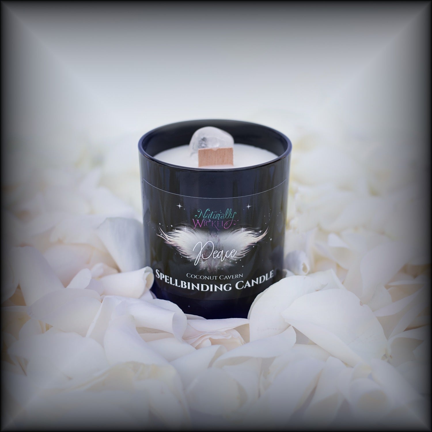 Naturally Wicked Spellbinding Peace Spell Candle Entombed With Quartz Crystal Sits Amongst White Petals