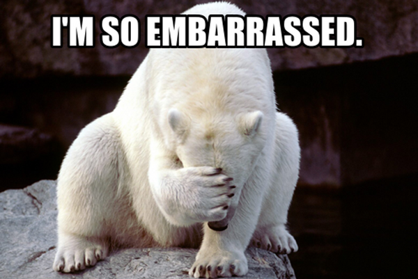 Polar bear shamefully hiding face with paw