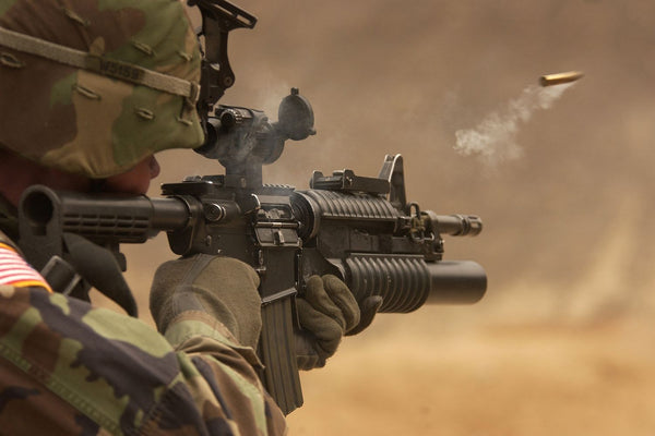 Soldier Firing Round From American Army Rifle