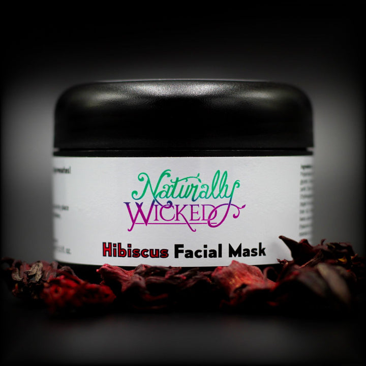 Naturally Wicked Hibiscus & Vanilla Facial Mask Behind Bright Red Dried Hibiscus Flowers  - Step 2