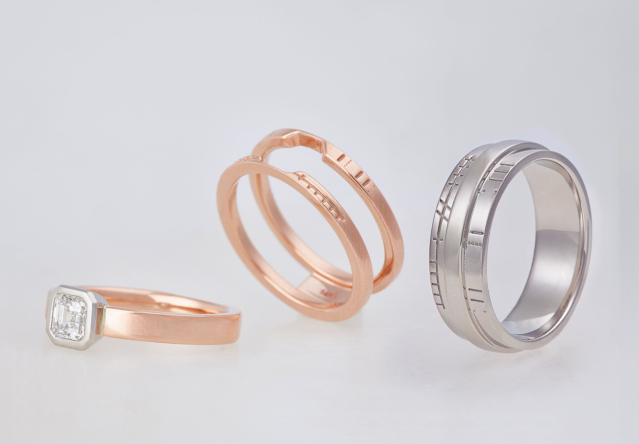 Wedding bands with Mayan numeric symbols and Ogham engraving