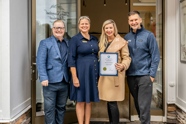 4 people stand in front of the new Scented Market store in the Blue Mountain Village. They are the Deputy Mayor and Mayor of the Town of the Blue Mountains, Founder and CEO Kristy Miller and the President of the Blue Mountain Village Association Andrew Siegwart.