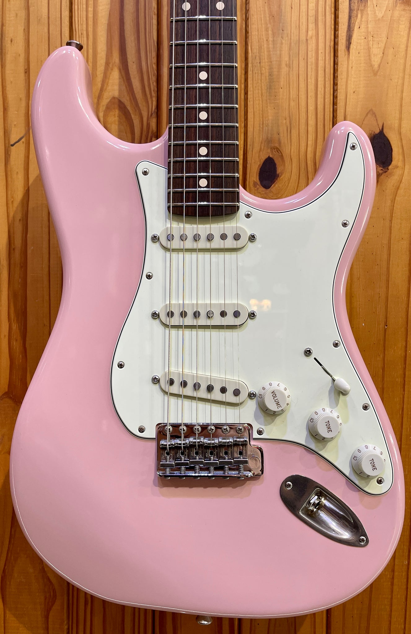 light pink bass guitar