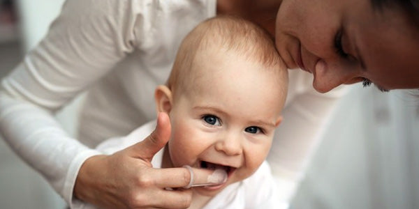 massaging baby's gums can help