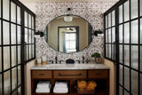 Hotel Figueroa - featuring framed factory window shower doors and toilet doors.