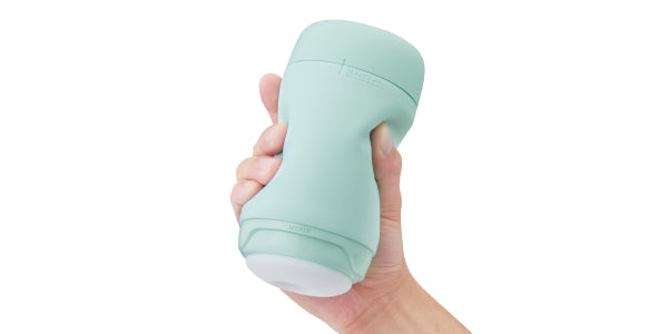 TENGA PUFFY Mint Green being squeezed by a hand