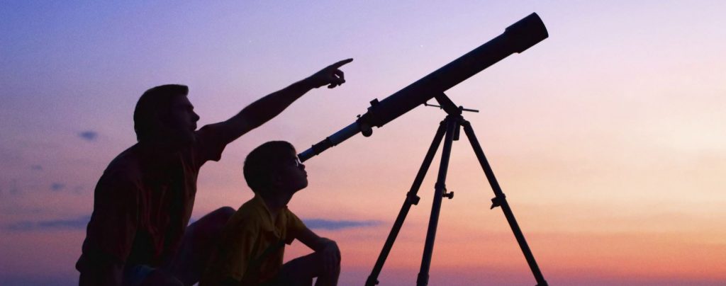 kid with telescope