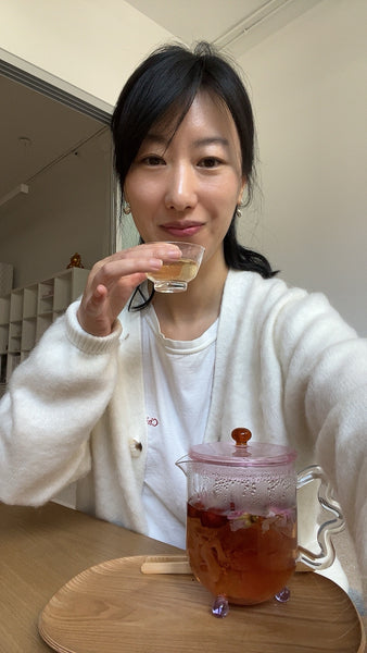 Lisa Li drinking The Qi rose jujube dates tea