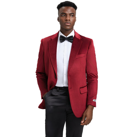 "Man in Red Wine velvet tuxedo suit with white shirt and black bow tie."