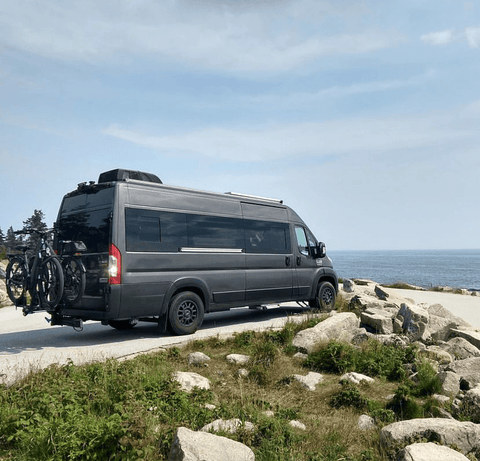 ram promaster campervan on the water edge