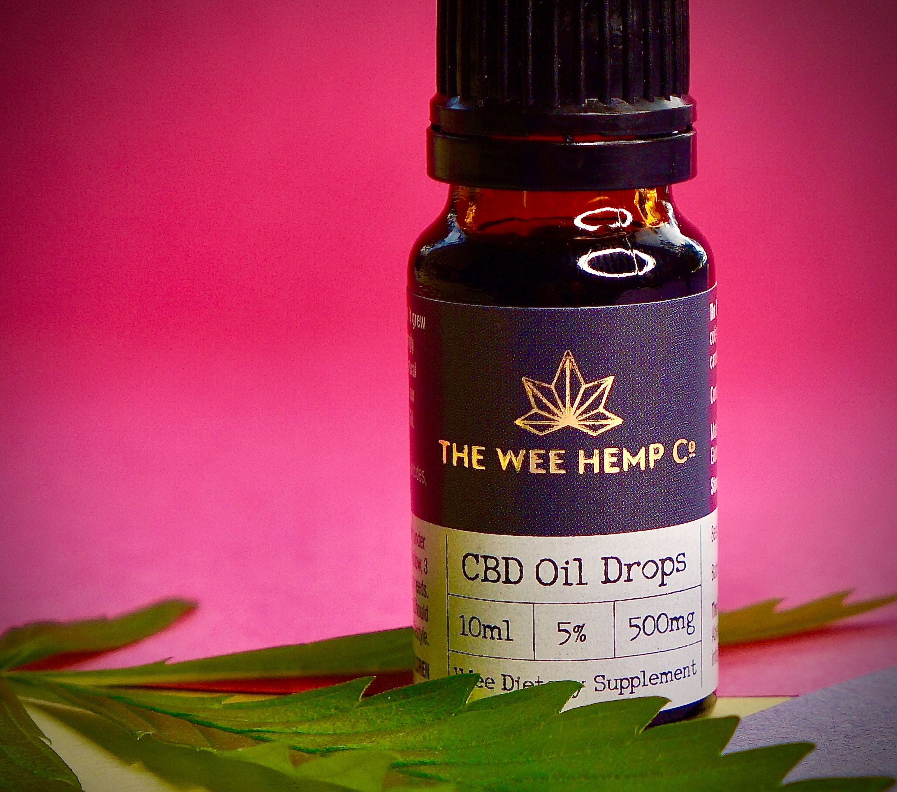 Wee Hemp Co. CBD PRODUCT, PINK BACKGROUND, CANNABIS LEAF PINK BACKGROUND - CANNABIS LEAF HOME PHOTOGRAPHY - SCOTLAND HEMP  - SCOTTISH HEMP ASSOCIATION - WEE HEMP COMPANY - SCOTLAND'S MULTI AWARD WINNING CBD COMPANY 