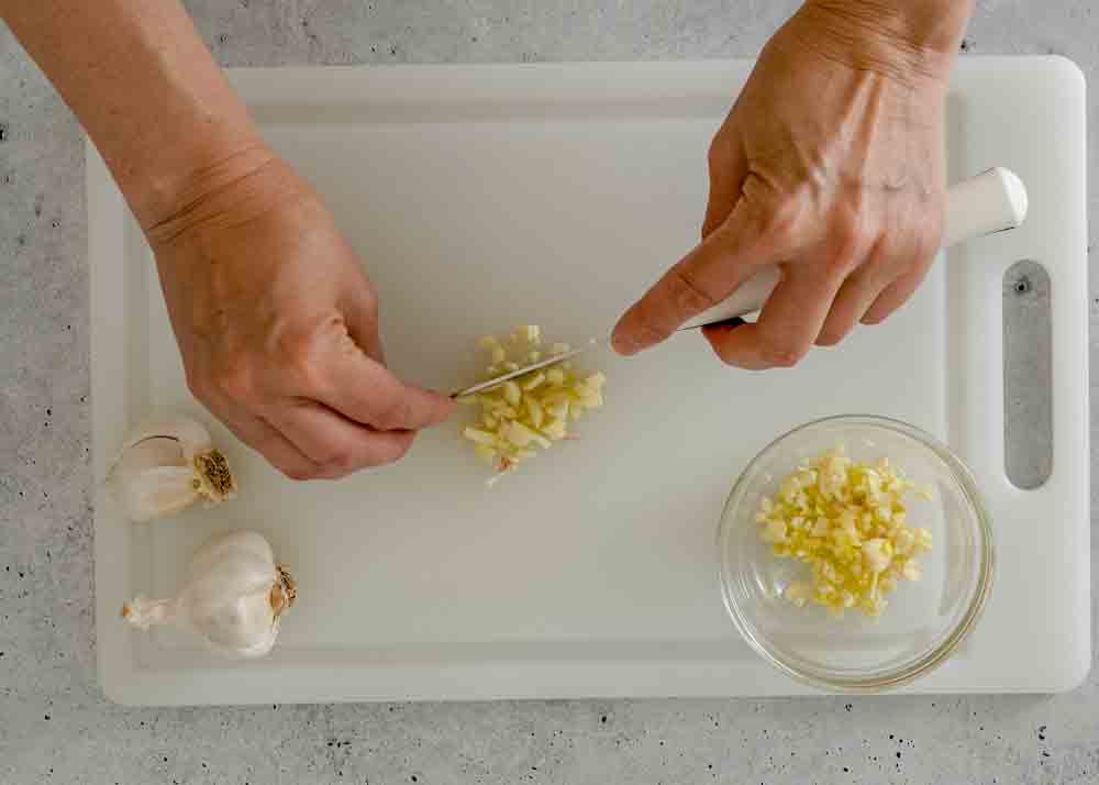 Chopping Garlic on Board