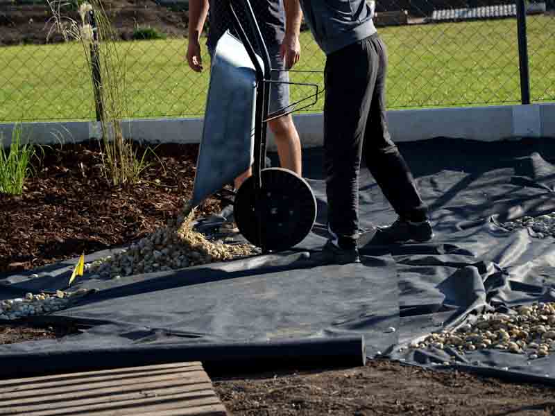 Putting Gravel on Landscape Fabric