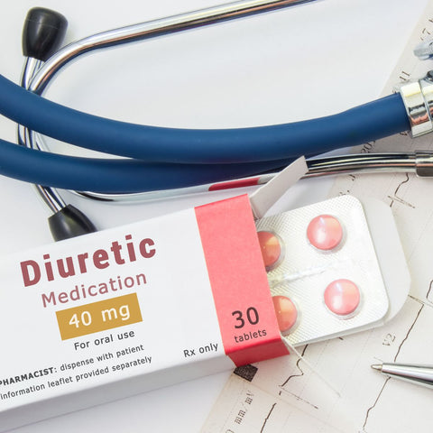 diuretic pills show in its packaging and a stethoscope in background