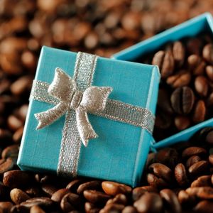 a gift box full of whole coffee beans to show a gift of coffee subscription toronto