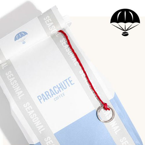 close-up of parachute seasonal coffee packaging with the parachute coffee logo in the corner