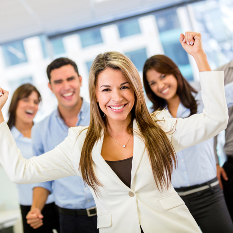 a happy business team using a mindset tool