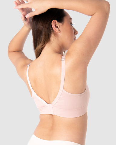 Caress Wirefree Bra - back side of the female wearing in light pink