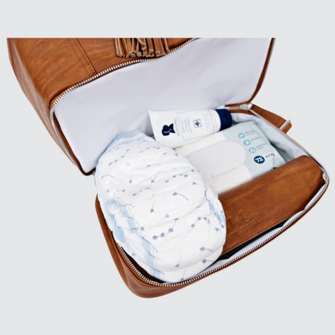 The Top 10 Must-Have Items for Your Diaper Bag Featuring a bag packed with diapers and wipes
