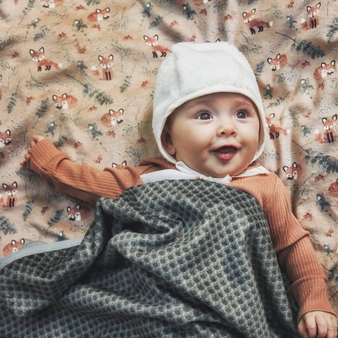 Winter Baby in a bonnet and blanket