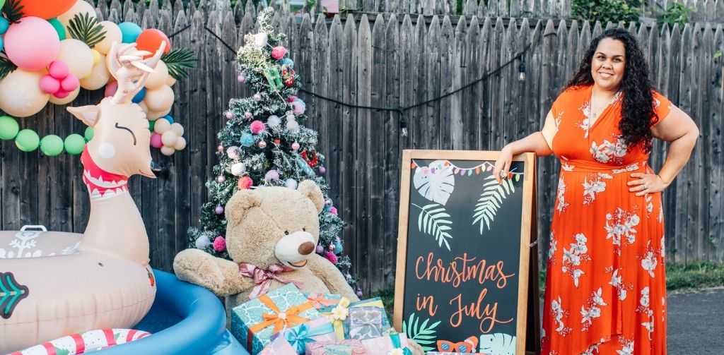 Samantha Howard poses with Christmas in July Party Decor