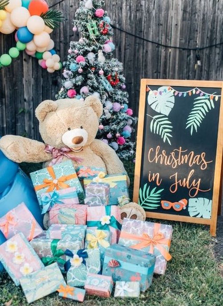 Christmas in July Tree, Sign, Teddy Bear, and Gifts