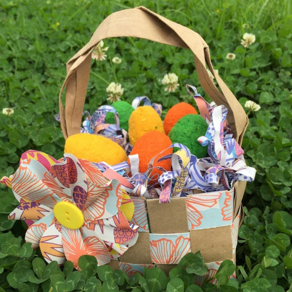 Colorful plantable seed bomb Easter eggs make a lovely basket -- and an awesome candy-free egg hunt idea.