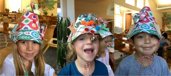 Kids wearing Christmas Wrapping Paper Hats